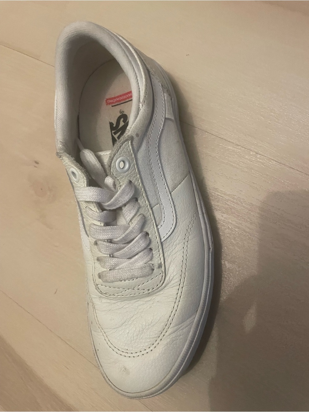 Vans women’s White Low-Top Leather Sneaker